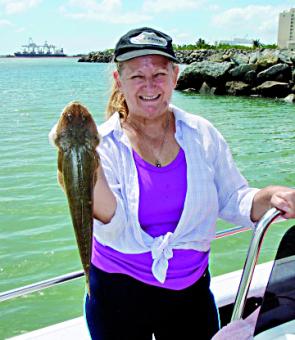 Sylvia Robertson with a nice flathead that was caught around the Townsville rock walls. When it is too windy to head offshore, fish like this still make it worthwhile putting the boat in.